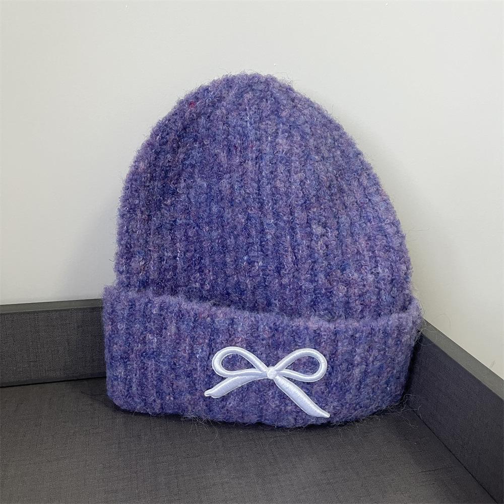 Hat women's autumn and winter wool hat new cute bow versatile cold hat ear protection warm knitted hat tide