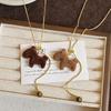 Autumn and winter flocking tiger's eye stone pony necklace retro temperament natal year versatile sweater chain light luxury high sense neck chain