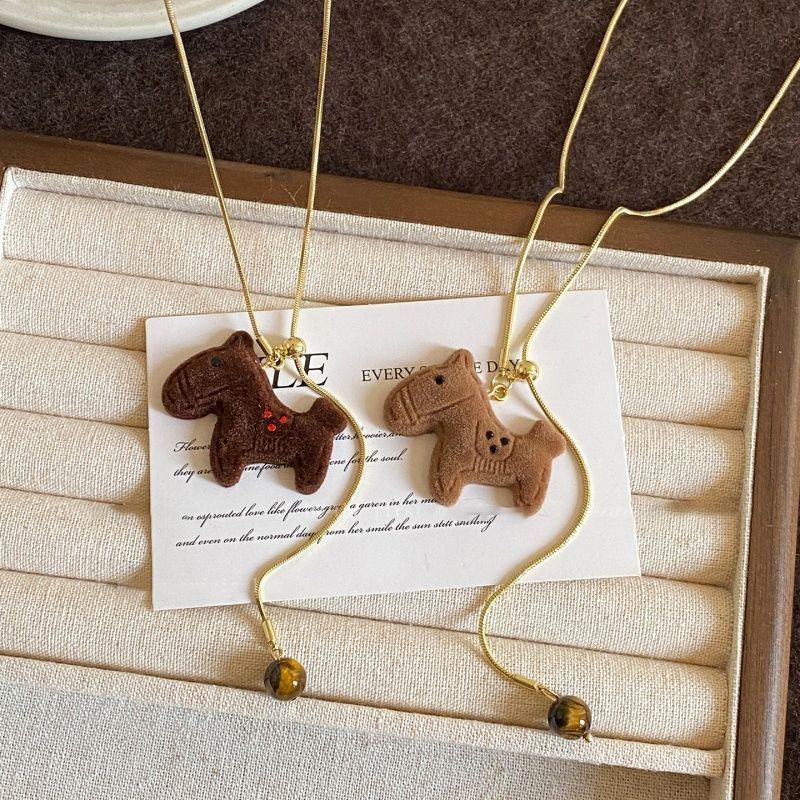Autumn and winter flocking tiger's eye stone pony necklace retro temperament natal year versatile sweater chain light luxury high sense neck chain