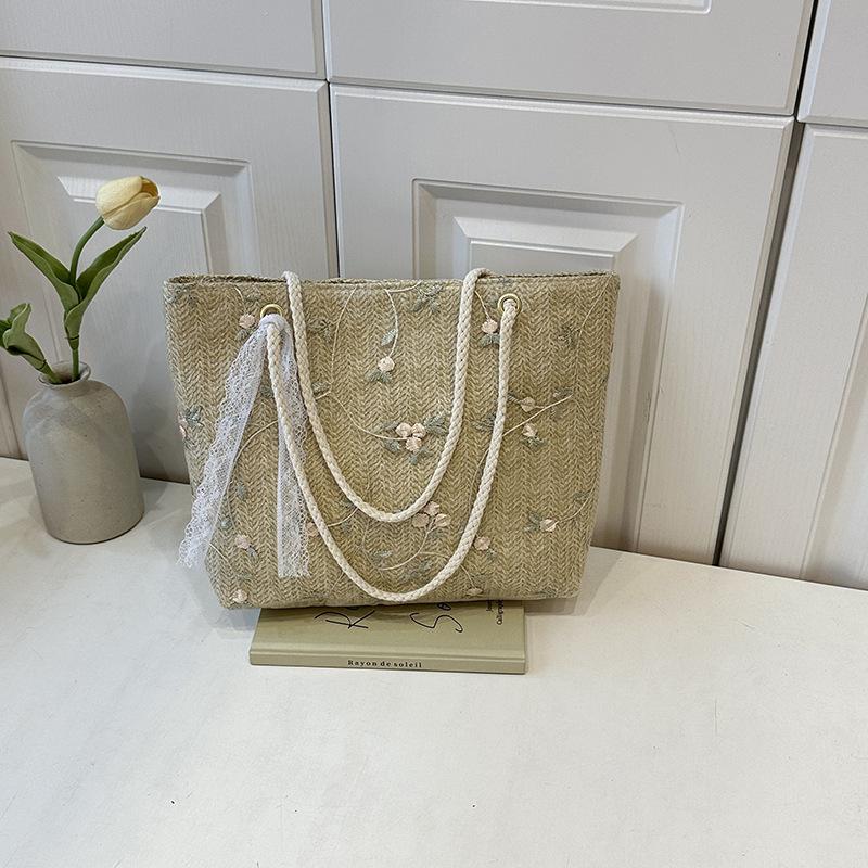 

Жіноча літня солом яна сумка, нова свіжа та проста мереживна плетена сумка з квітами в іноземному стилі, пляжна сумка через плече
