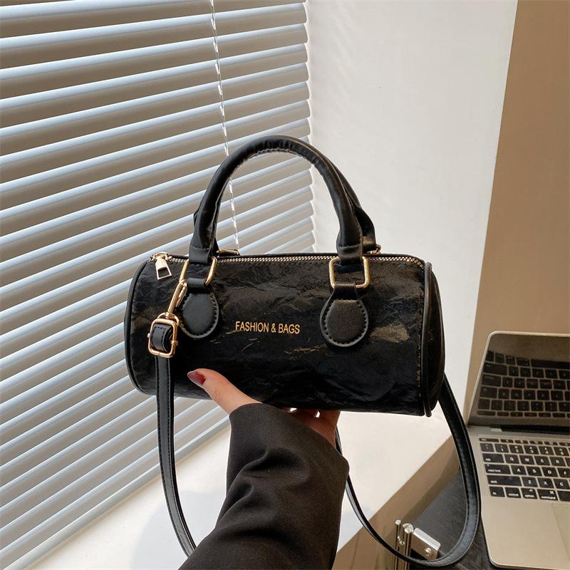 Niche design cylinder handbag new temperament versatile high sense messenger bag fresh and sweet shoulder bag