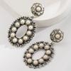 Retro Heavy-duty Hollowed-out Flower Turquoise Earrings for Women - Creative, Exaggerated, High-end Ear Jewelry.