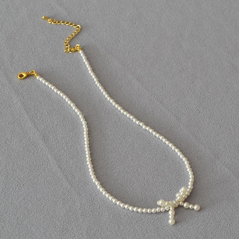 French Niche Elegant and Bright Imitation Shijia Pearl Bow Shape Simple Temperament Short Necklace Choker Woman