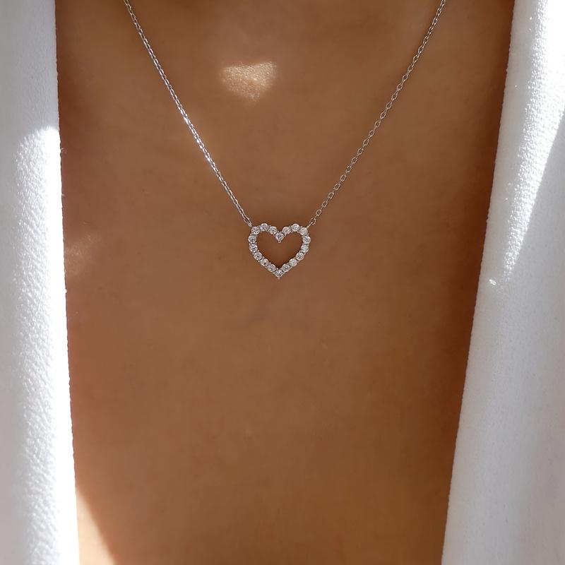 A Pendant Necklace for Women with a Rhinestone-embellished Hollow Heart Design for Valentine's Day