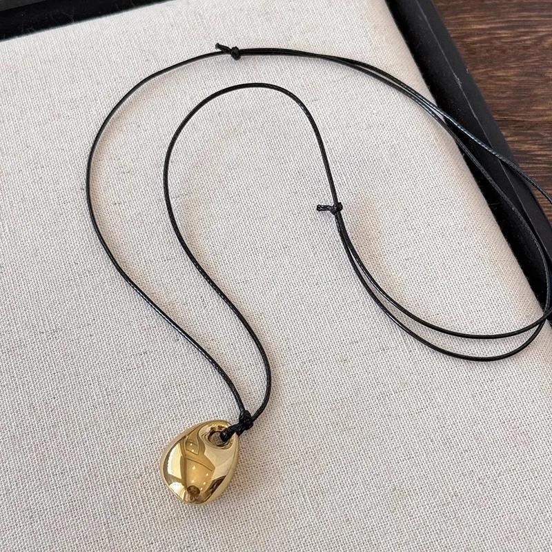 

Minimalist Black Leather Rope Necklace Women s Autumn and Winter Simple Fashion Irregular Metal Pendant Long Sweater Chain