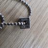 Used moschino silver necklace square dice