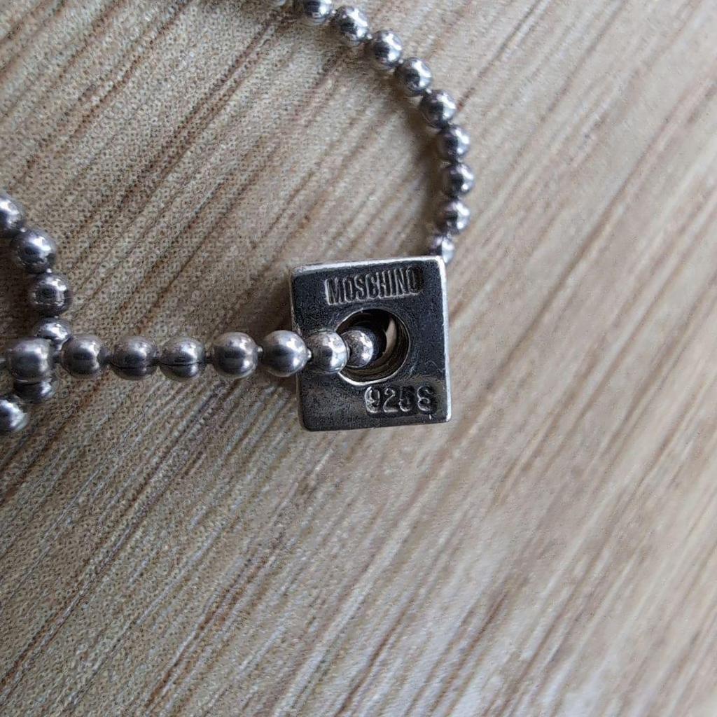 Used moschino silver necklace square dice