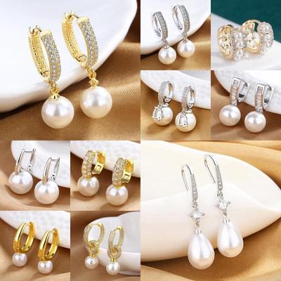 Boucles d'oreilles de luxe à perles pour femmes - Design français tendance, style mondain sophistiqué, personnalisables.