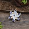 New enamel color hollow geometric camellia magnetic brooch women's fashion versatile three-dimensional flower corsage
