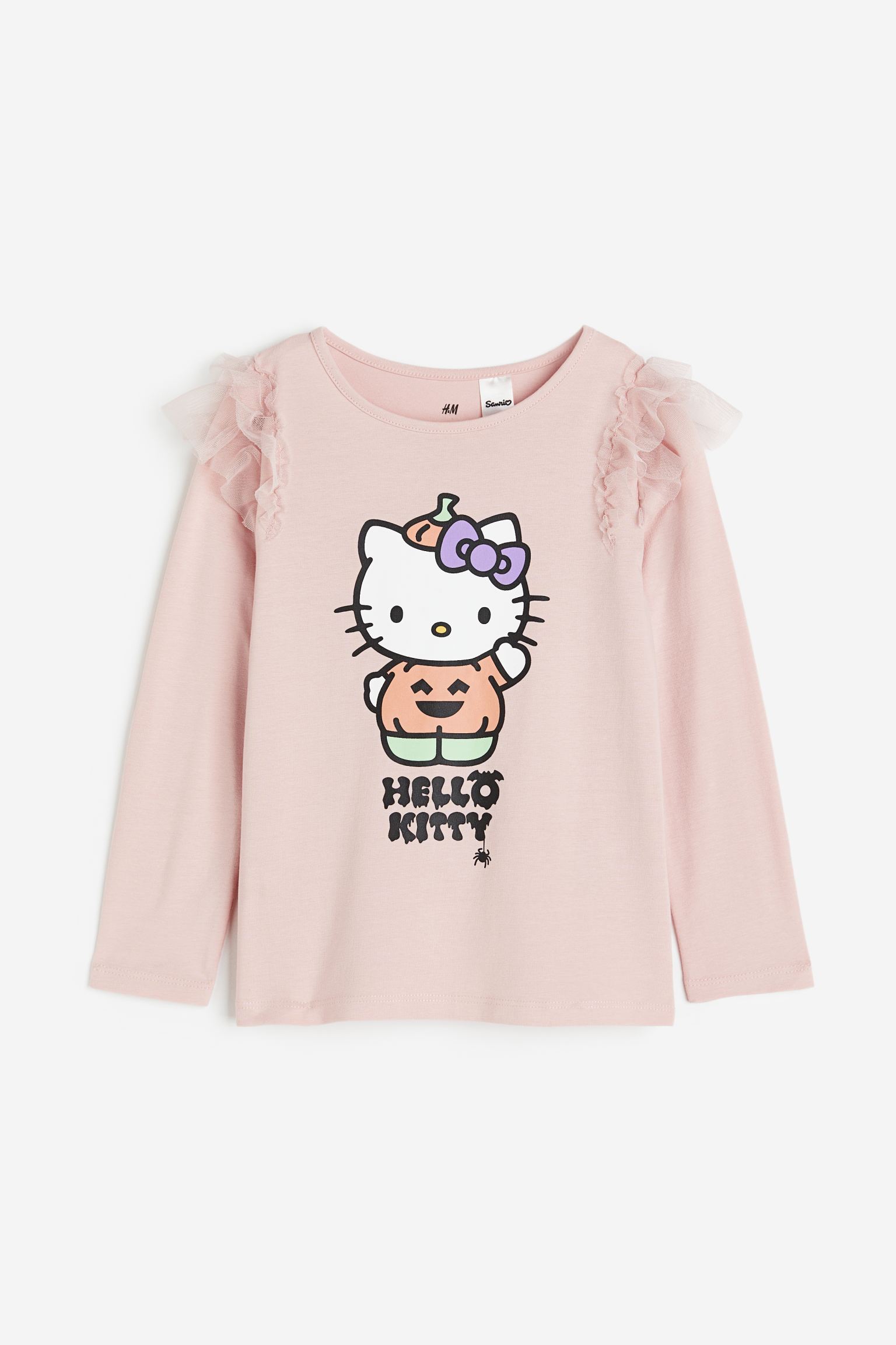 

Топ с принтом и оборками