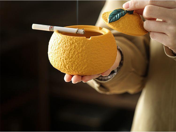 Resin Orange Ashtray with Lid - Creative, Anti-Fly, Stylish Living Room or Office Decor.