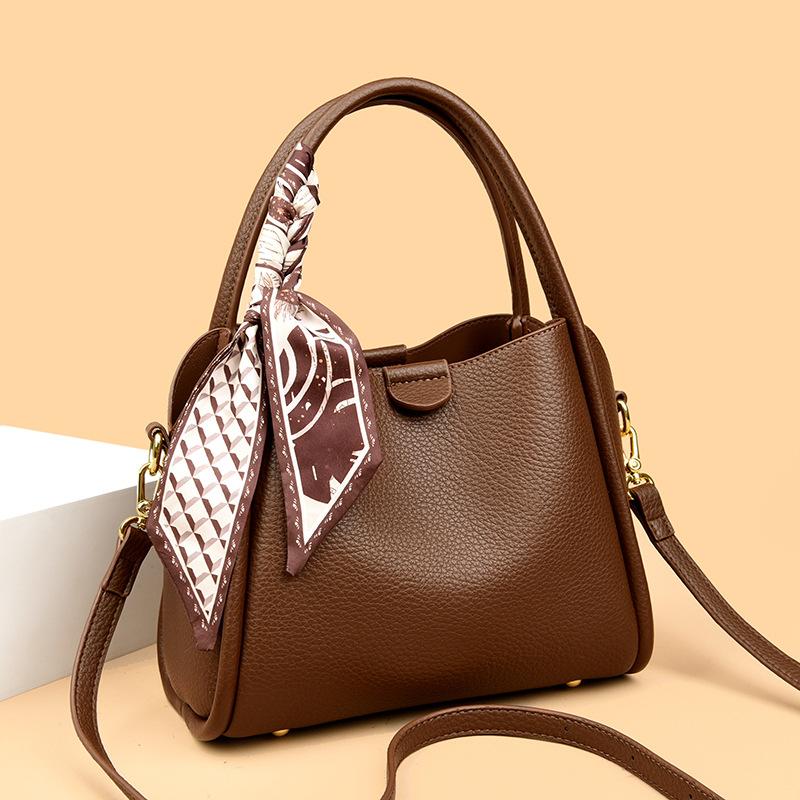 This Bucket Bag Is A Simple and Fashionable Urban Design with A Lychee Pattern and A Silk Scarf. It Is A Hand-held Shoulder Bag