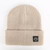 Autumn and winter smiley face labeling wool hat solid color couple versatile warm knitting classic casual hat men and women tide