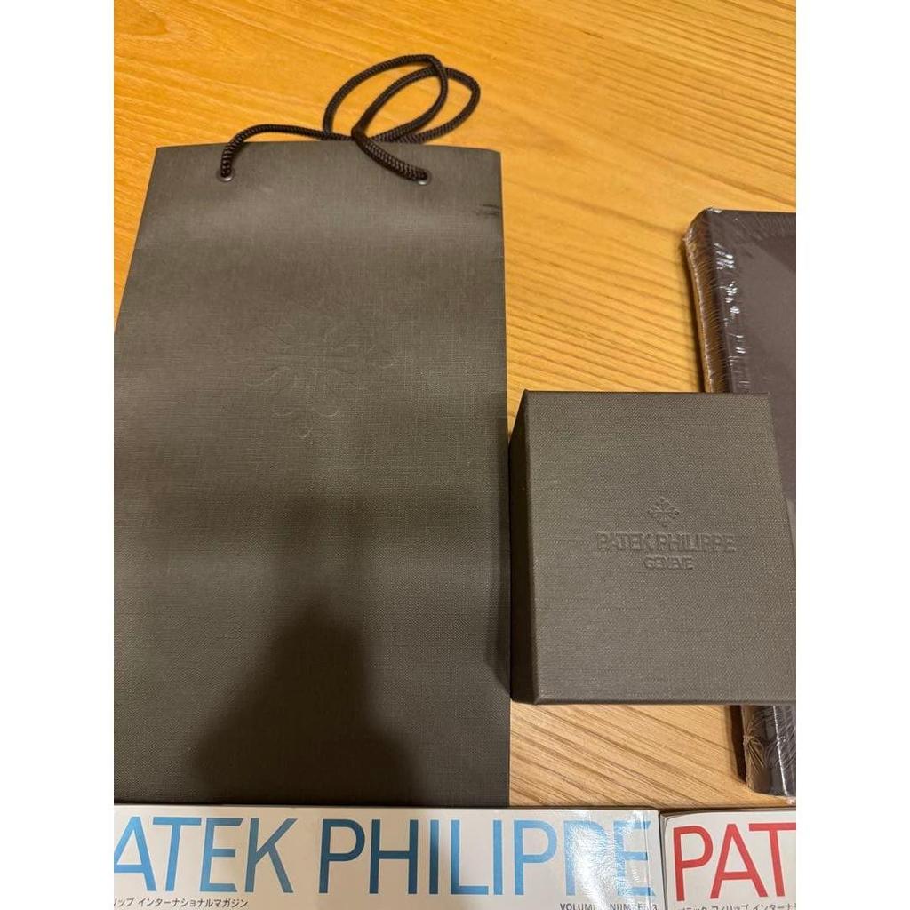 Used Patek Philippe collection book, 2 magazines, and travel case