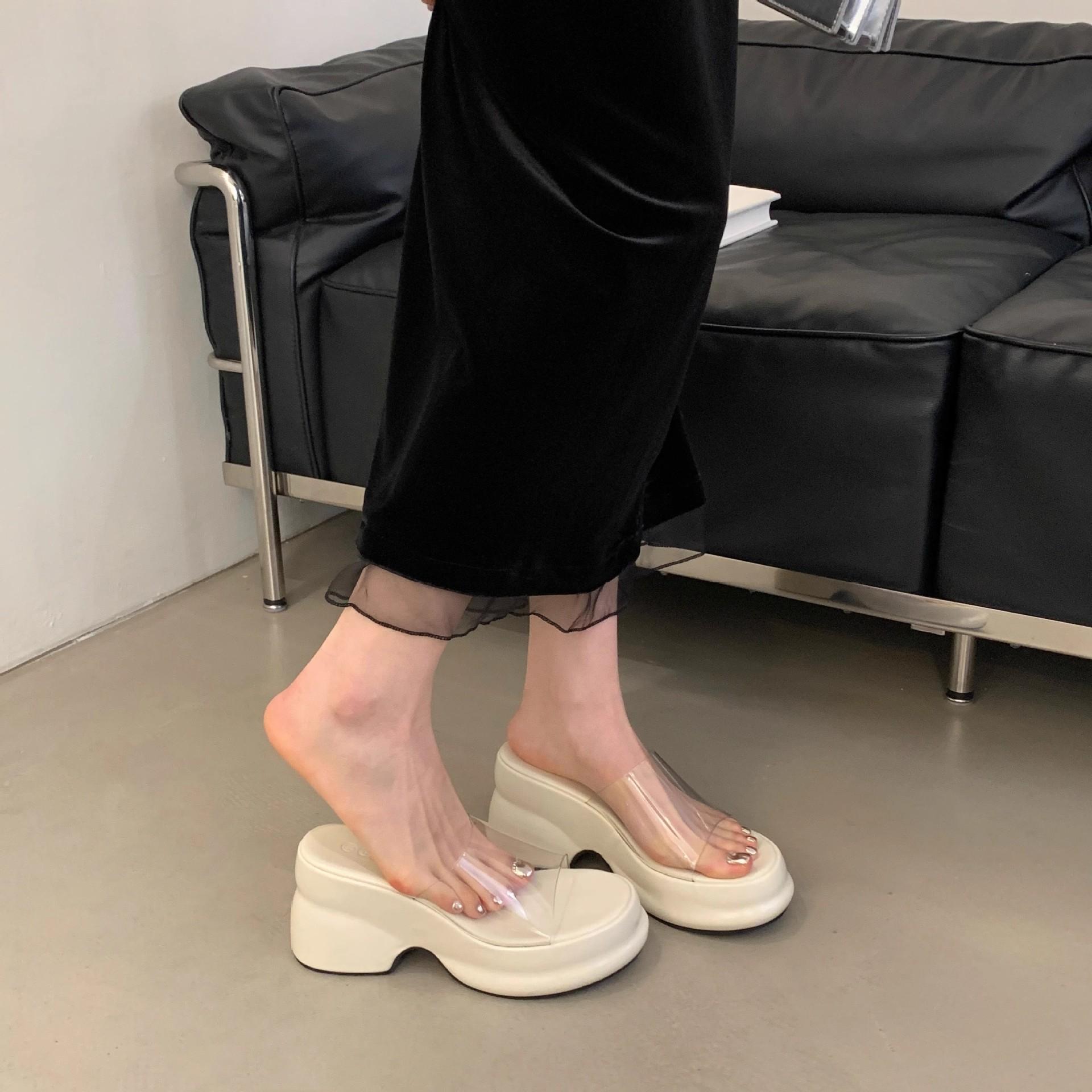 

Thick bottom slope heel cool slippers women s new muffin bottom thick heel high heel transparent one-word slippers waterproof table 40