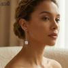 EFFIE QUEEN Boucles d'oreilles pendantes en argent pur 925 et or 14 carats avec perles de culture baroques. Bijou idéal pour les femmes, cadeau de fête de mariage GPE05