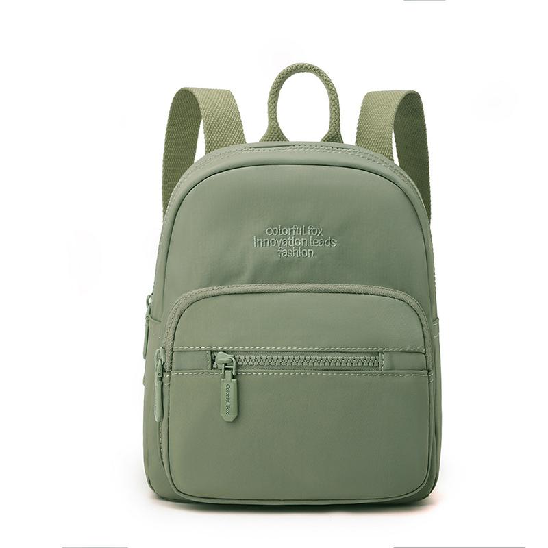 

Solid Color Mini Backpack with Front Zipper Pocket Lightweight Casual Bag for Students and Daily Use світло-зелений колір
