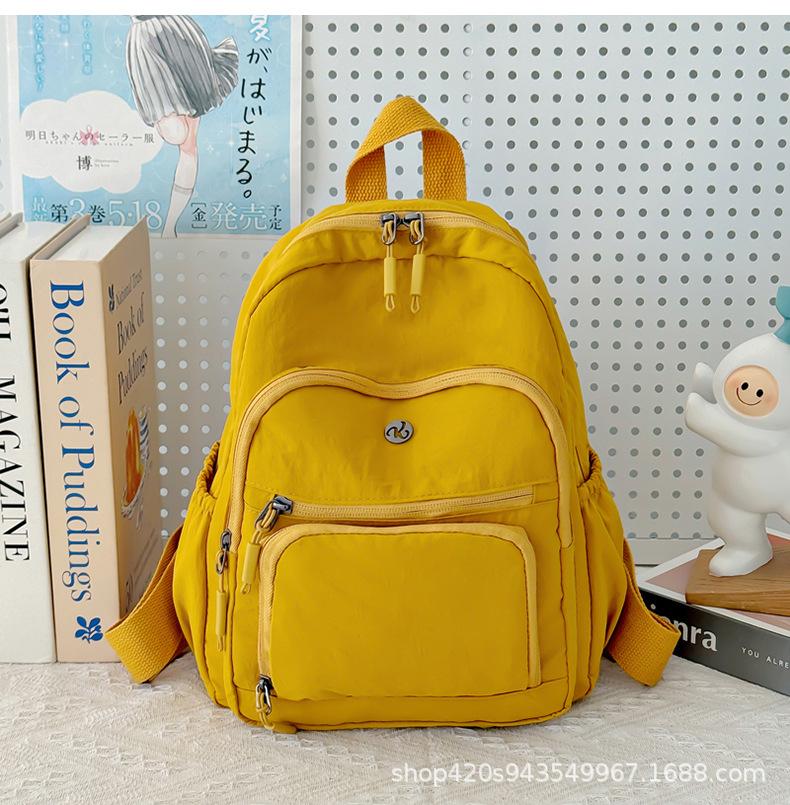 Schoolbag spot wholesale simple fashion backpack high sense niche women outdoor travel commuter small bag