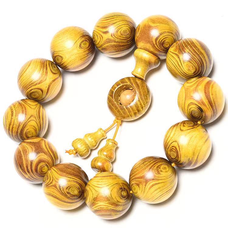 Exquisite Double-Eye Ghost Face Gold Thread Buddhist Bead Bracelet In Premium Wood