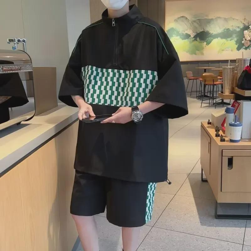 

Костюм-рубашка унисекс из зеленой клетчатой ткани с контрастной строчкой и короткими рукавами - летний свободный комплект из двух предметов M чёрный