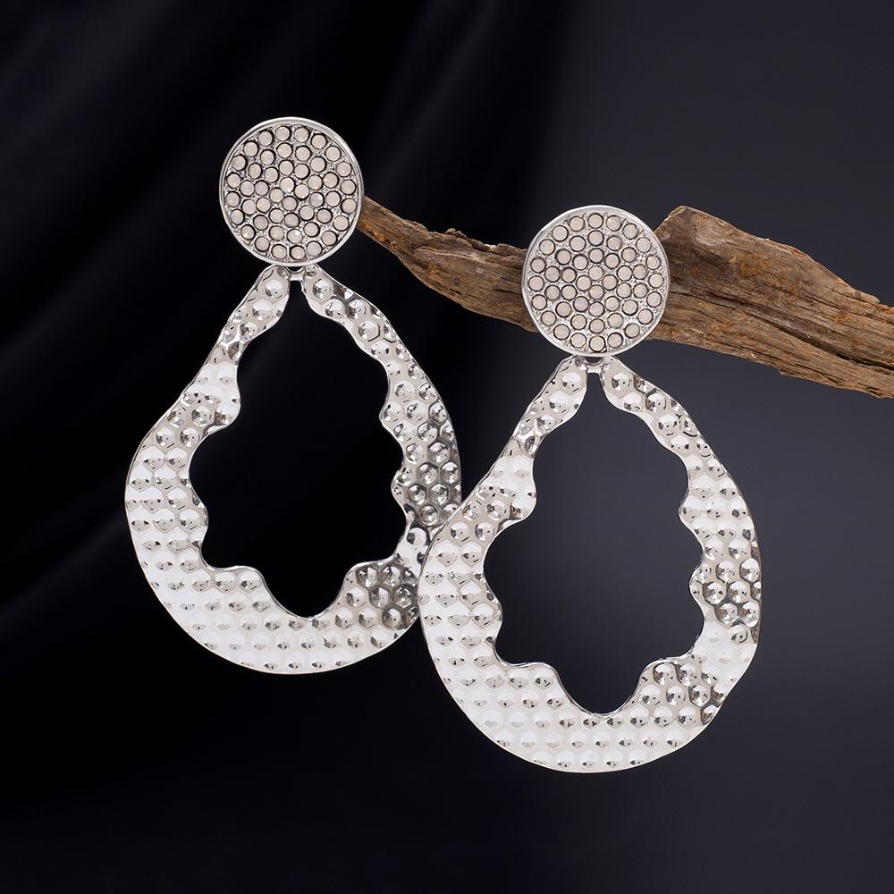 Minimalist Women's Geometric Teardrop Earrings with Irregular Hollow Design and Zinc Alloy Diamond Inlays