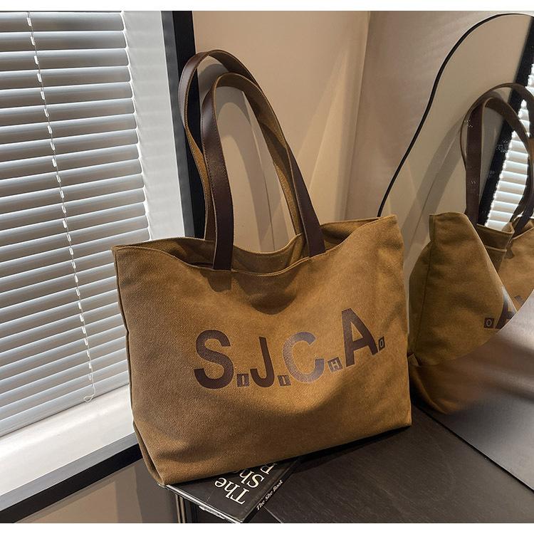 

Large capacity canvas bag women s 2024 new shoulder bag casual versatile tote work universal bag коричневий