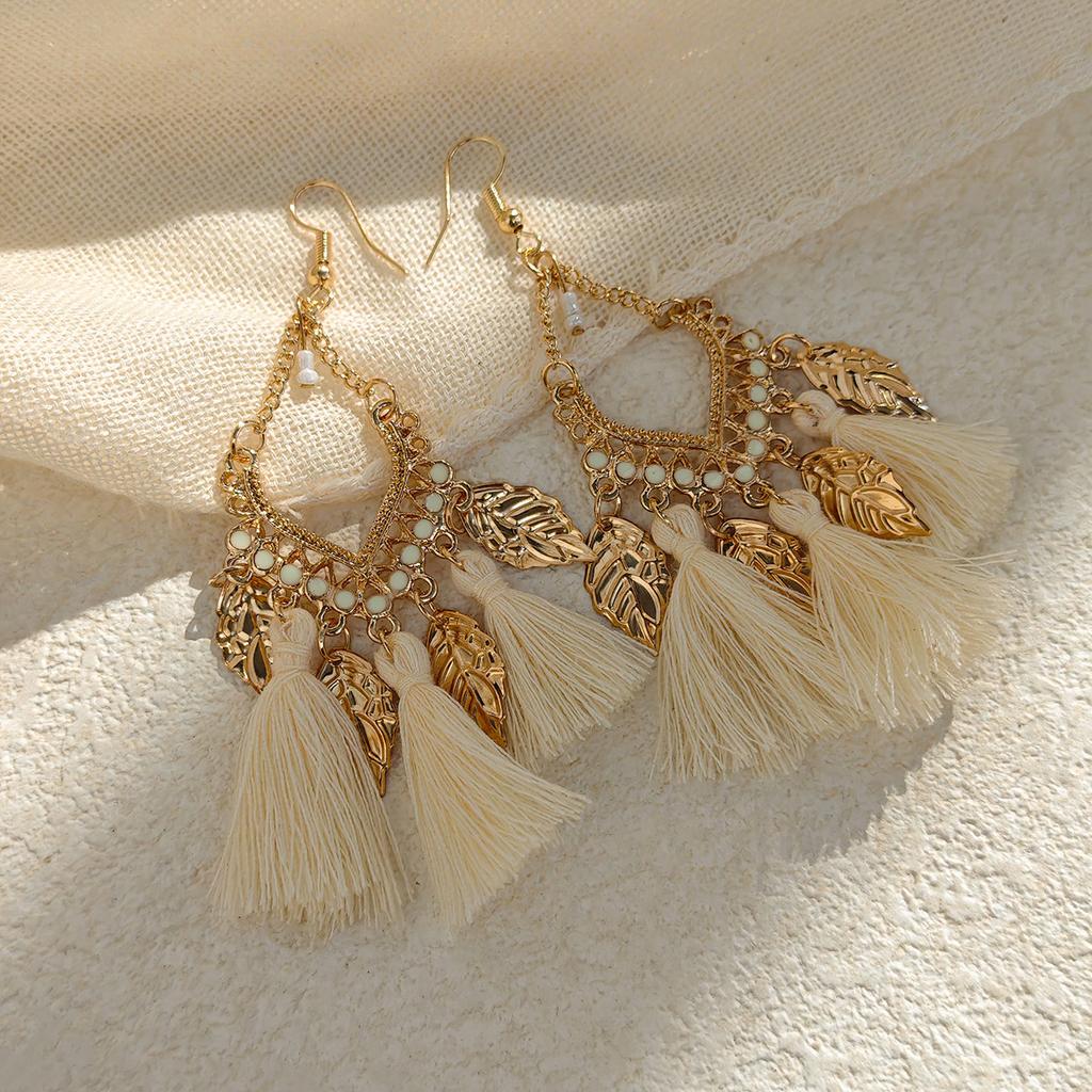 Retro ethnic style woven feathers long fringed earrings, bohemian high-end hollow rice bead earrings