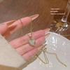 Elegant European and American Heart Necklace: Gold-Plated Copper Love Pendant for Women