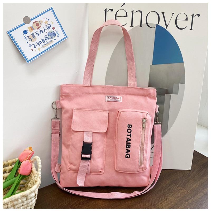 

Fashion versatile canvas bag hot sale new casual shoulder messenger bag double shoulder schoolbag large capacity multi-purpose schoolbag women рожевий