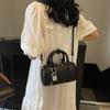 Fashion hand-held bowling bag women's 2025 summer new simple commuter shoulder bag niche trend messenger women's bag