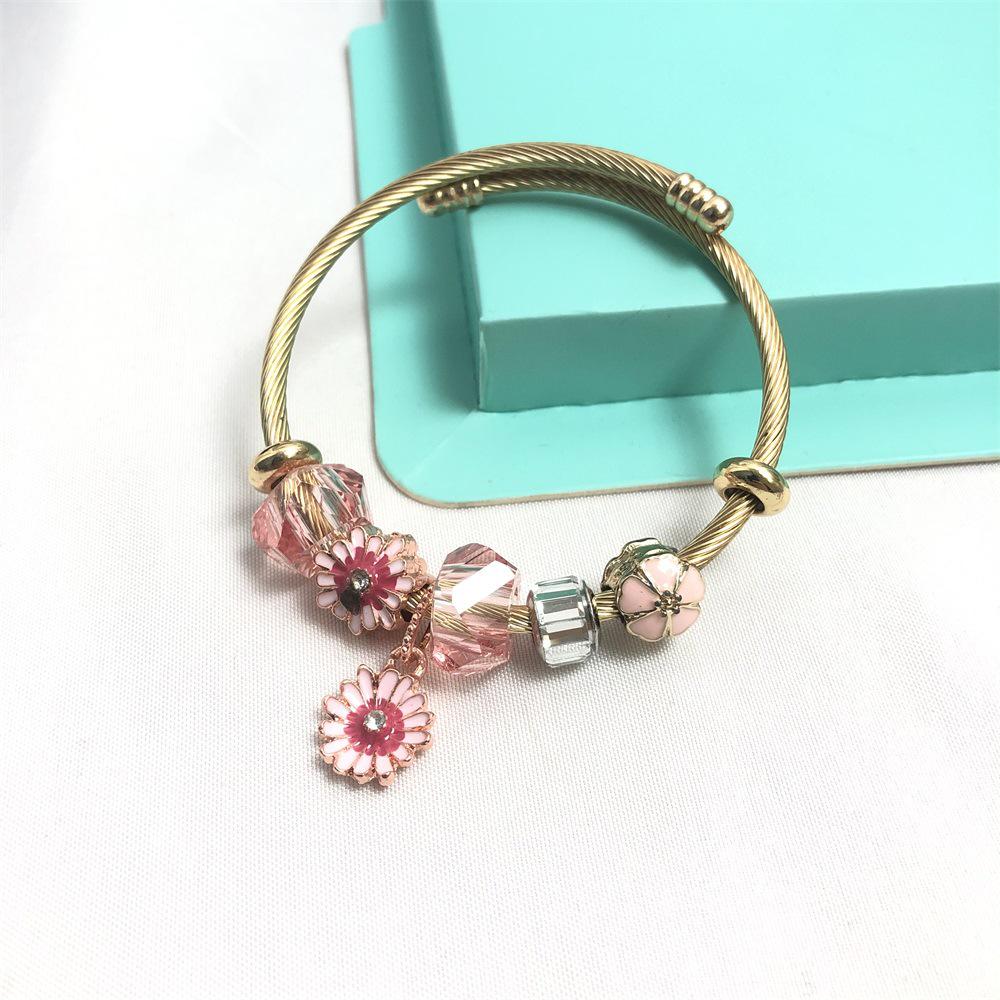 

Tri-Color Stainless Steel Bracelet with Glass Crystal Flower Pendant