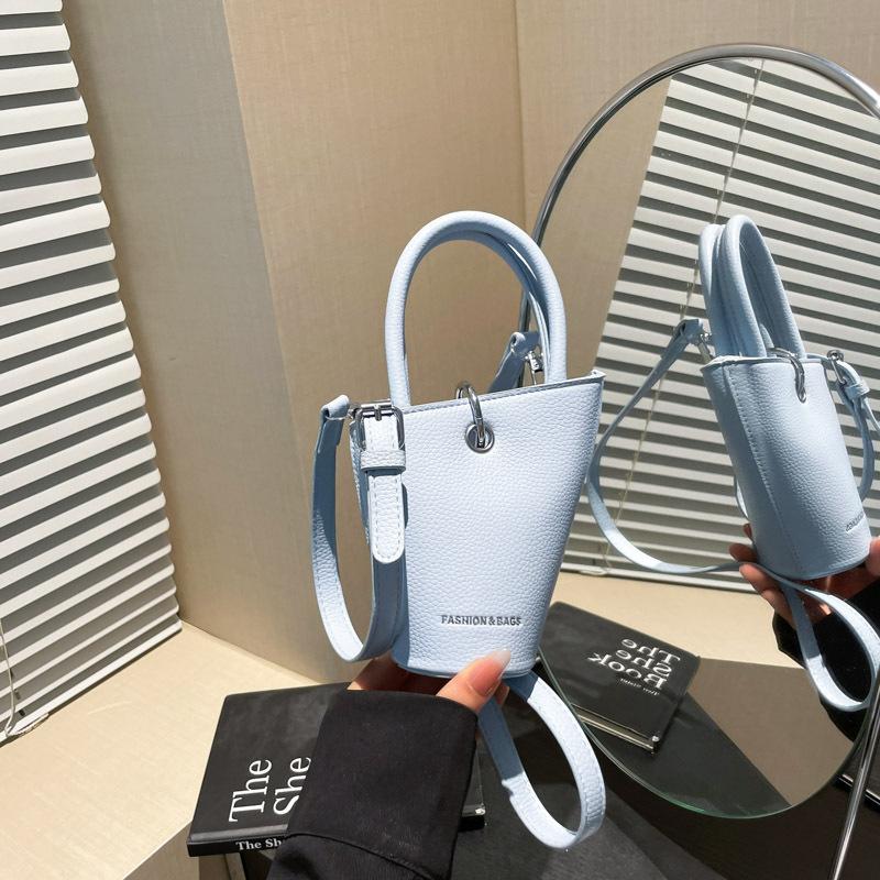 Niche design fashionable versatile hand bag women's summer new simple retro messenger bucket bag
