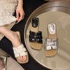 Flat-bottomed slippers women wear fashionable beach sandals in the summer of 2025, versatile Internet celebrity temperament
