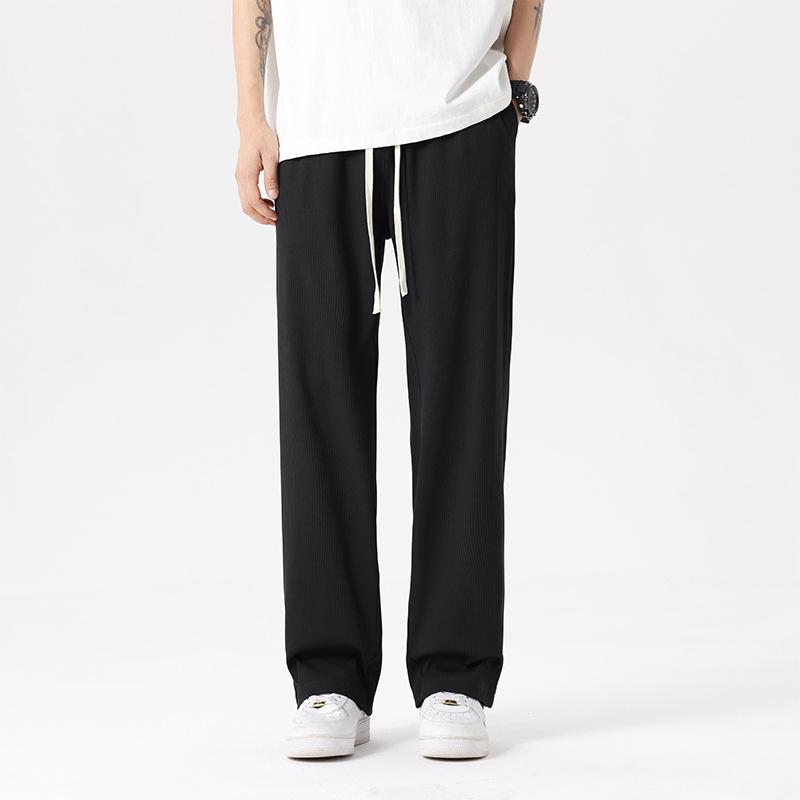 

Новые весенние и летние повседневные брюки Ice Silk, мужские тонкие спортивные брюки, черные свободные брюки с завязками на ногах и девятью точками 4XL