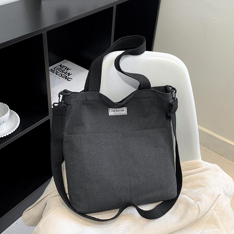 

Canvas bag new women s merchandise Guochao vertical messenger bag boys small backpack versatile ins shoulder bag