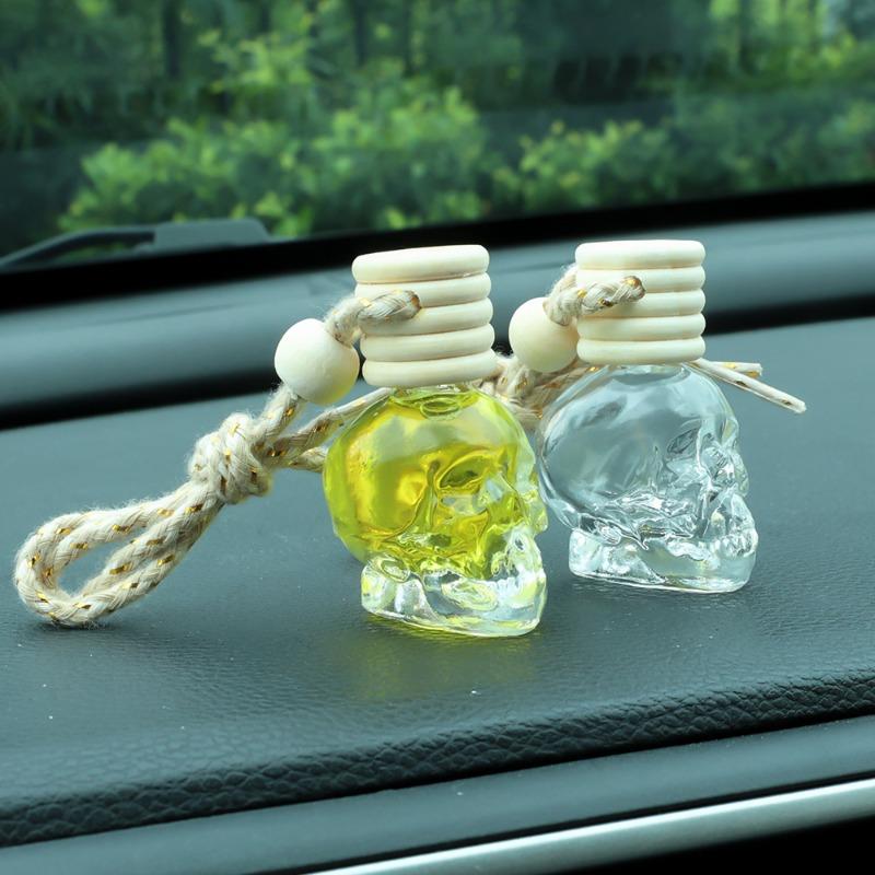 Auto-Lufterfrischer-Diffusor, Aromatherapie-Flasche mit ätherischen Ölen, zum Aufhängen, transparente Totenkopf-Parfümflasche, reinigendes Autozubehör