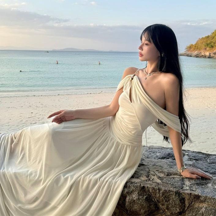 French white off-the-shoulder hollow pleated dress, high-end female summer pure desire wind vacation beach fairy long dress