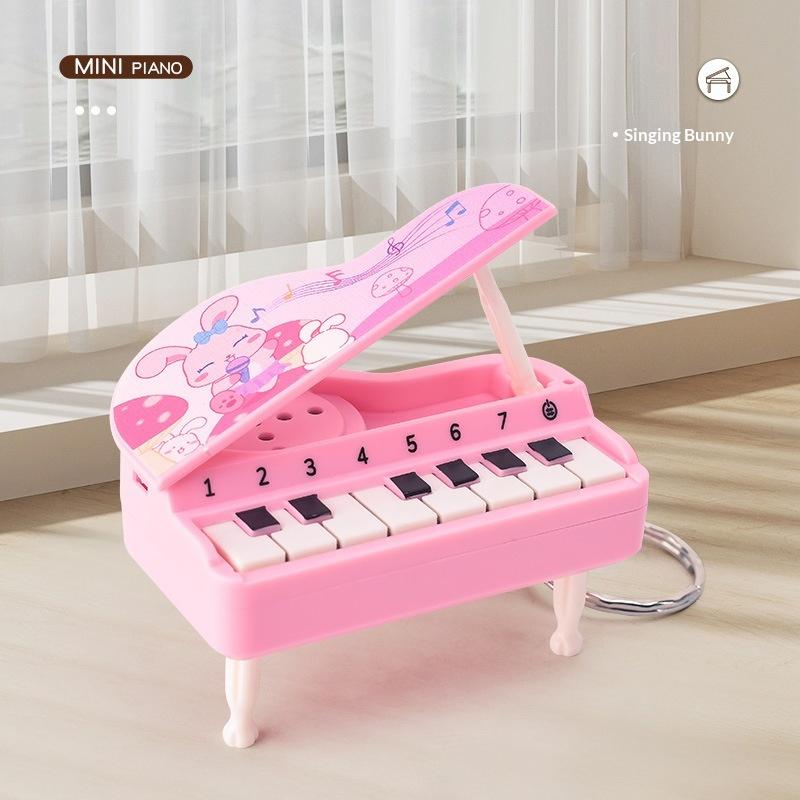

Mini Desktop Piano Keychain Cute Music Game Machine Bag Pendant Children S Educational Toy Easter Gift рожевий
