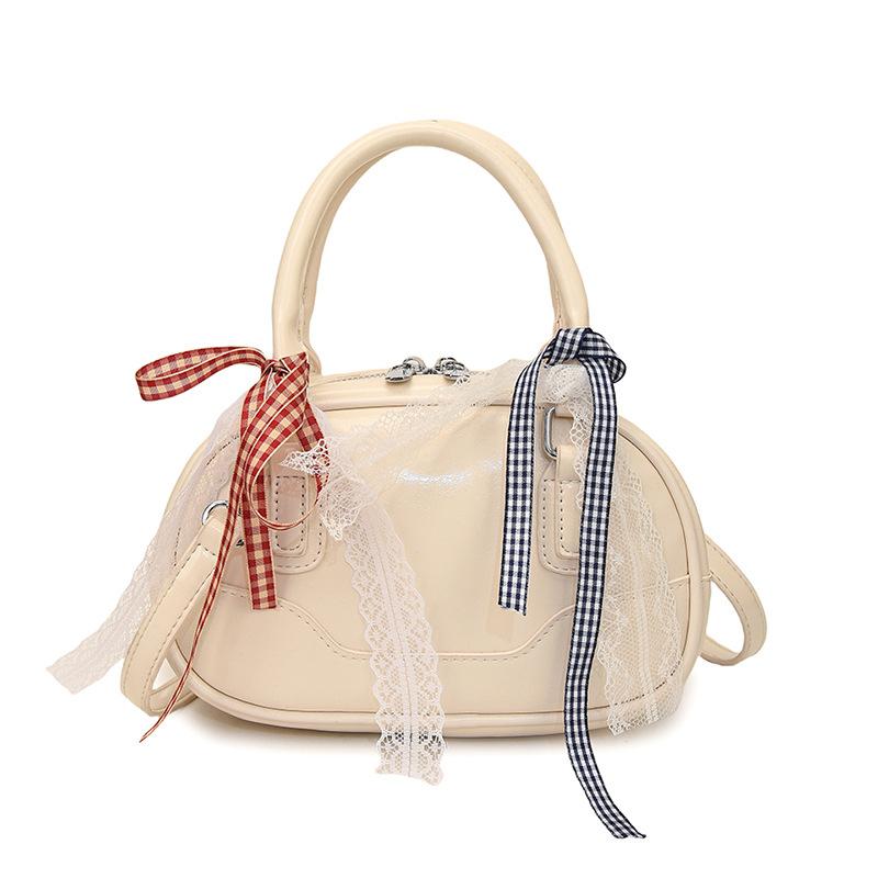 Frühling 2025 neu Ou Ruofeng Koreanische Version von einfacher tragbarer Boston-Tasche Nische lässig vielseitige Umhängetasche Tasche Damen