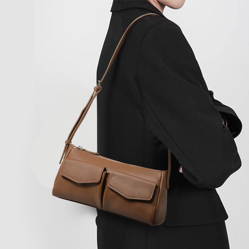2025 new high-grade niche leather postman female Baotou layer cowhide commuter one-shoulder underarm bag