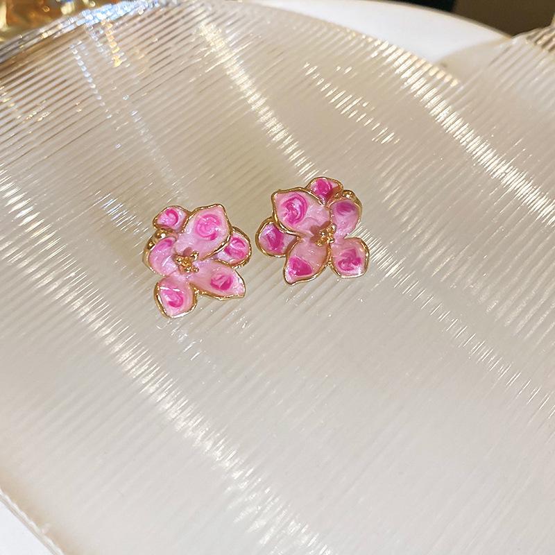 Boucles d'oreilles bohèmes roses à fleurs de perles de rocaille et pompons de perles