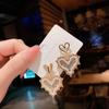 Fashion Geometric Bow Flower Pearl Earrings Women'S Premium Versatile Small Fragrant Wind Earrings