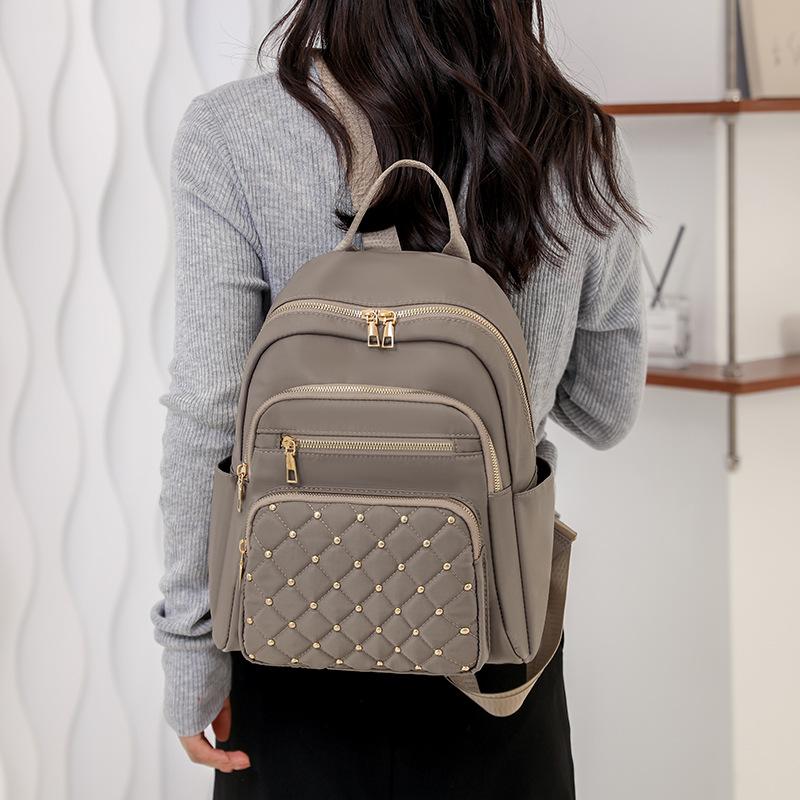 Solid Color Diamond Grid Car Stitching Rivet Fashionable Backpack with Women's Texture, Large Capacity, Simple Backpack