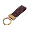 M65221 Шарм брелок кожа Monogram Porte Cledragonne Другие аксессуары Коричневая кожа унисекс Б/у