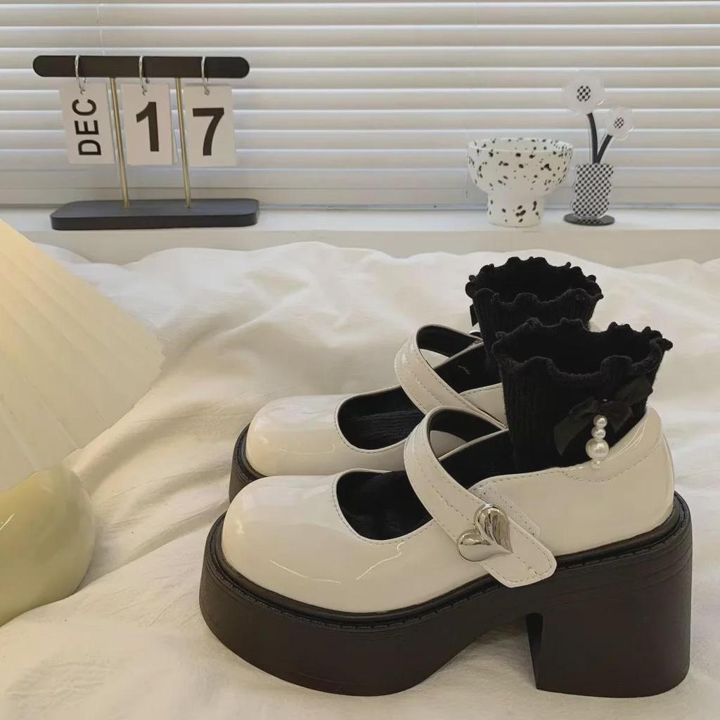 Mary Janes mit Plateauabsatz aus schwarzem Leder für Damen im Frühjahr 2024