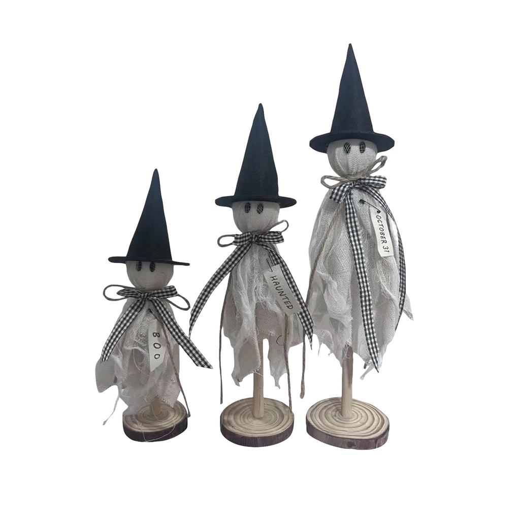 Three Halloween Are Placed On A Wooden Stand In The Center Of The Halloween Desktop For Indoor Decoration