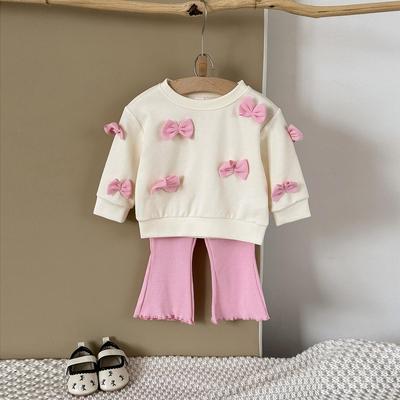 Completo due pezzi stile coreano per bambina con top con fiocco 3D e pantaloni a zampa