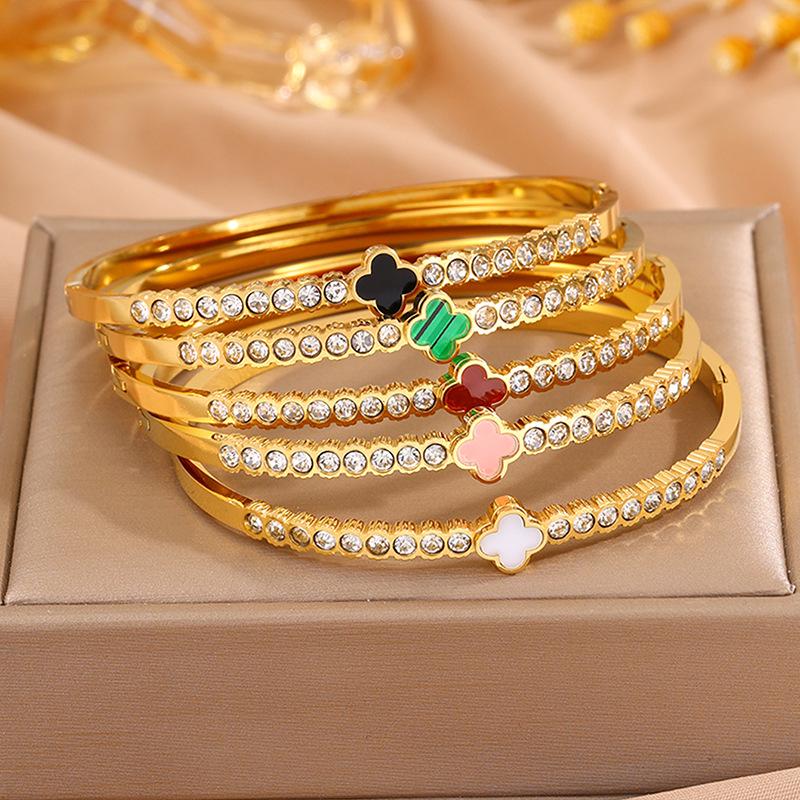 Titanium steel  women's light luxury high-end sense four-leaf flower with diamonds does not fade lucky grass open  
