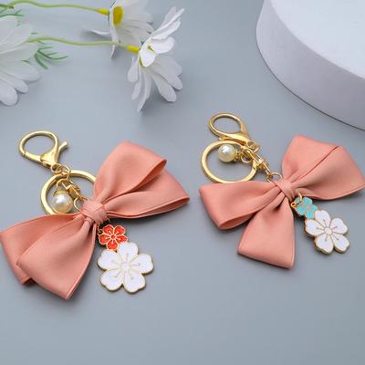 Cute Sakura Bowtie Keychain Fashion Pearl Chain Handbag Charm Car Keyring Earphone Case DIY Ornament for Women Souvenir Jewelry