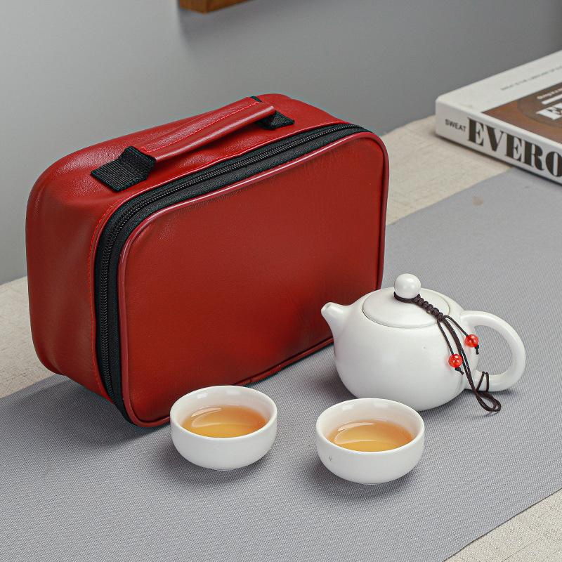 

Convenient travel kung fu tea set, one pot and four cups of express red leather bag, simple package.